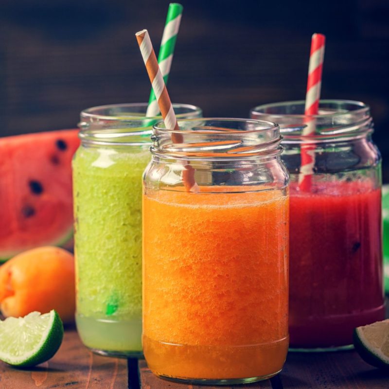 Image of glasses of brightly-colored smoothies with watermelon, orange, and lime to promote fresh fruit smoothie ppma private physicians medical associates