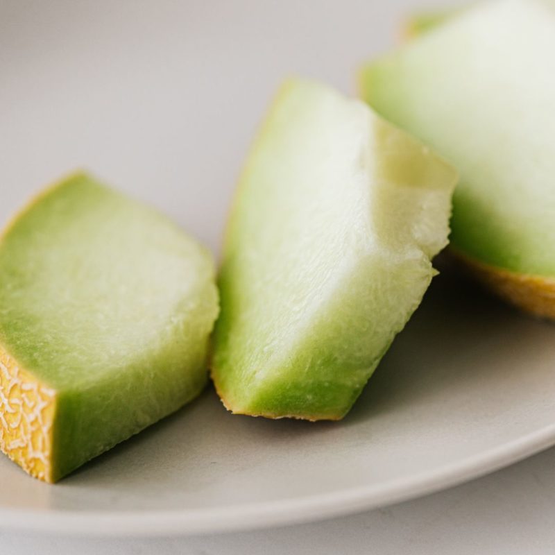 Image of sliced honeydew melon on a white plate to promote fresh fruit smoothie healthy recipe ppma private physicians medical associates
