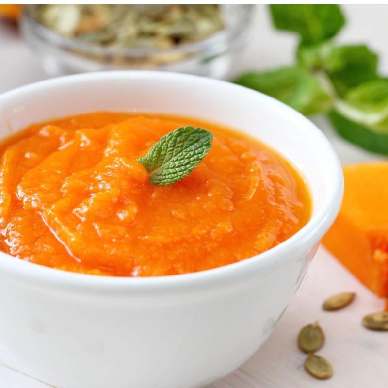 This is an image of homemade pumpkin puree with a basil leaf for a healthy recipe nutritionist ppma