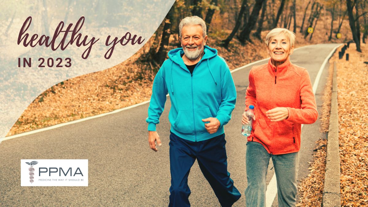 Image of mature middle aged older couple outside jogging on a mountain road for healthy you in 2023 PPMA private physicians medical associates
