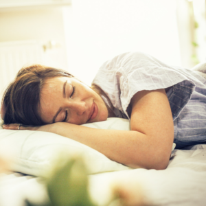 Image of a woman asleep on her bed for PPMA sleep diary