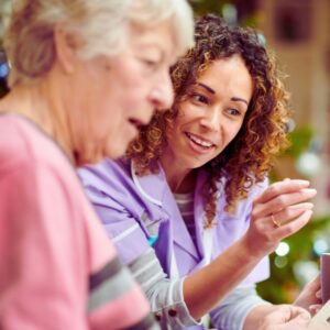 Image of a health care worker with an older woman patient. PPMA private physicians medical associates