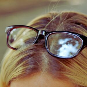 Image of eyeglasses atop a person's head. Memory screening. PPMA private physicians medical associates