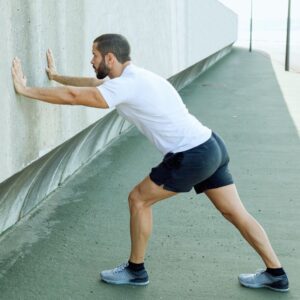 Profile image of man doing stretches for foot and ankle health PPMA private physicians medical associates