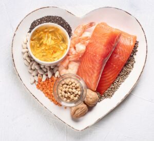 Image of white heart-shaped dish with foods rich in omega-3 salmon ppma private physicians medical associates