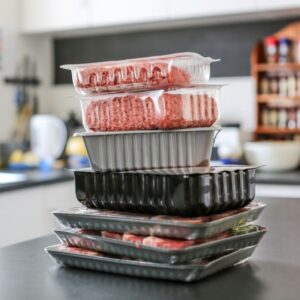 This image shows a stack of packaged meats. Sodium, nitrates and more.