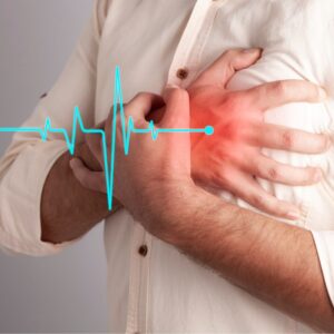 An image of a person clutching their chest with graphics showing the red of a heart attack and a life graph.