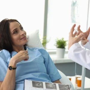 An image of a woman patient listening to her physician.