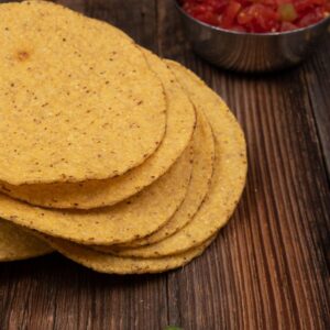 An image of zuchini, onion, garlic, and tomato. summer veggie tostada