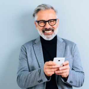 An image of a handsome middle-aged man with a silver beard,