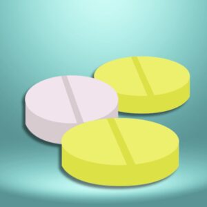 An image of two yellow and one white medicinal tablets