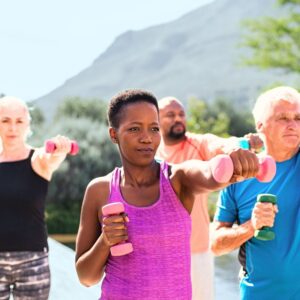 An image of a group of senior adults using hand weights to do strength-training.