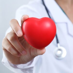 An image of a doctor holding out a red heart. Understanding Blood Pressure: What the Numbers Mean