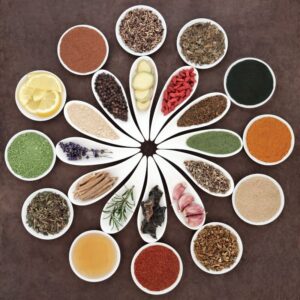 Immune boosting health food selection in porcelain dishes over lokta paper background. Boost Your Immune System