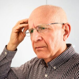 A senior man experiencing dementia