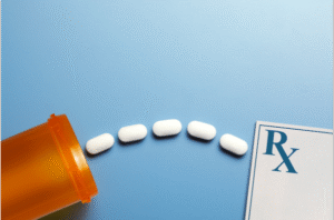 Prescription Medication on blue background. Pills, Prices & Prime: Finding a Pharmacy That Works for You After Rite Aid’s Exit