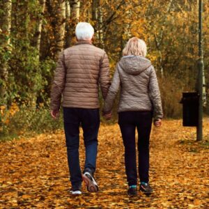 A couple taking a walk outside after their evening meal to help with digestion and other important body functions